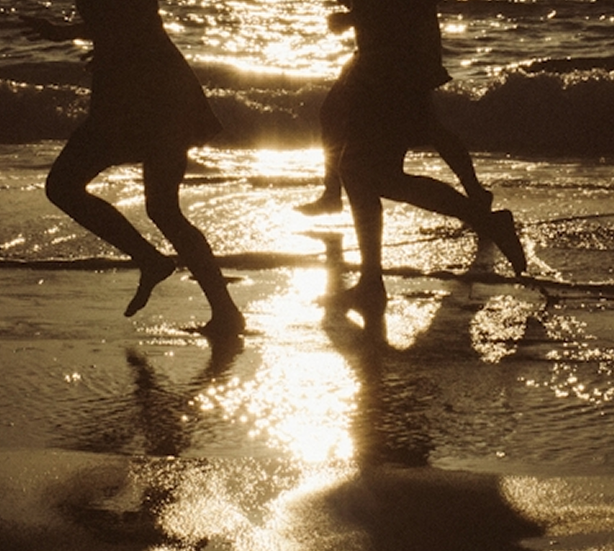 Running on the beach at dusk