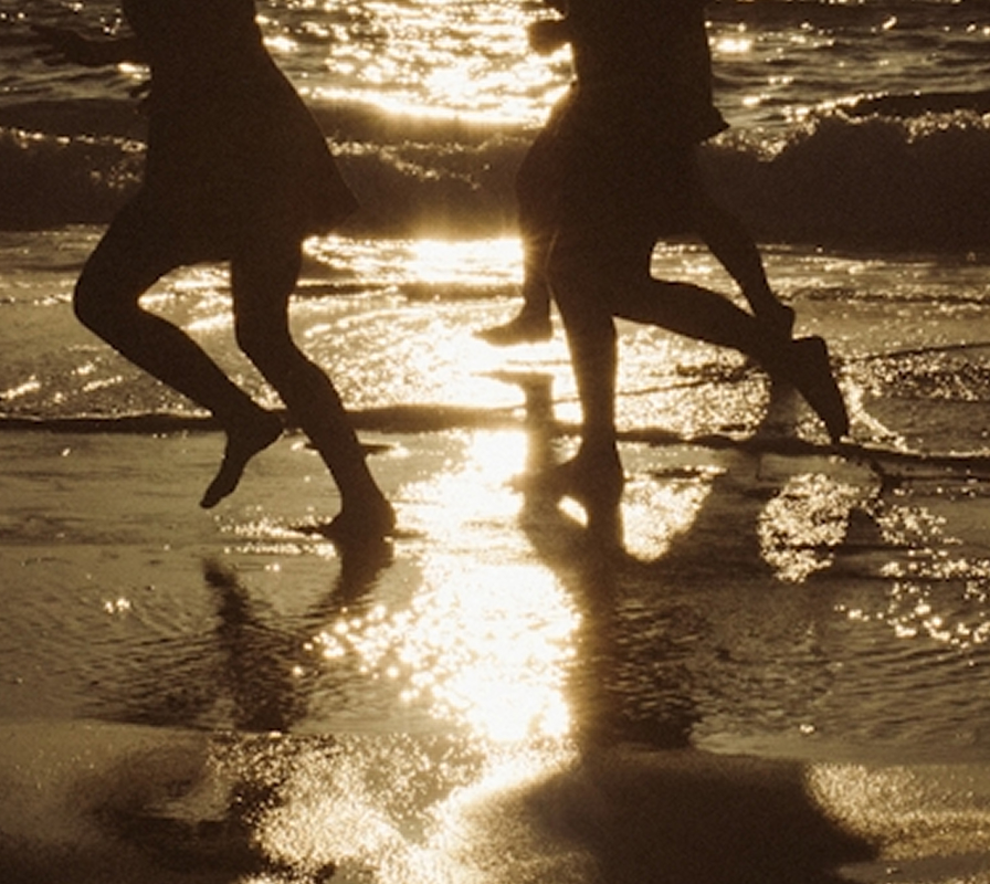 Running on the beach at dusk